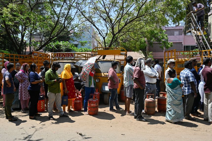 People gather in front of an LPG agency to have their cylinders refilled, amid supply disruptions following the US-Israeli conflict with Iran, in Chennai, India, on March 11, 2026.