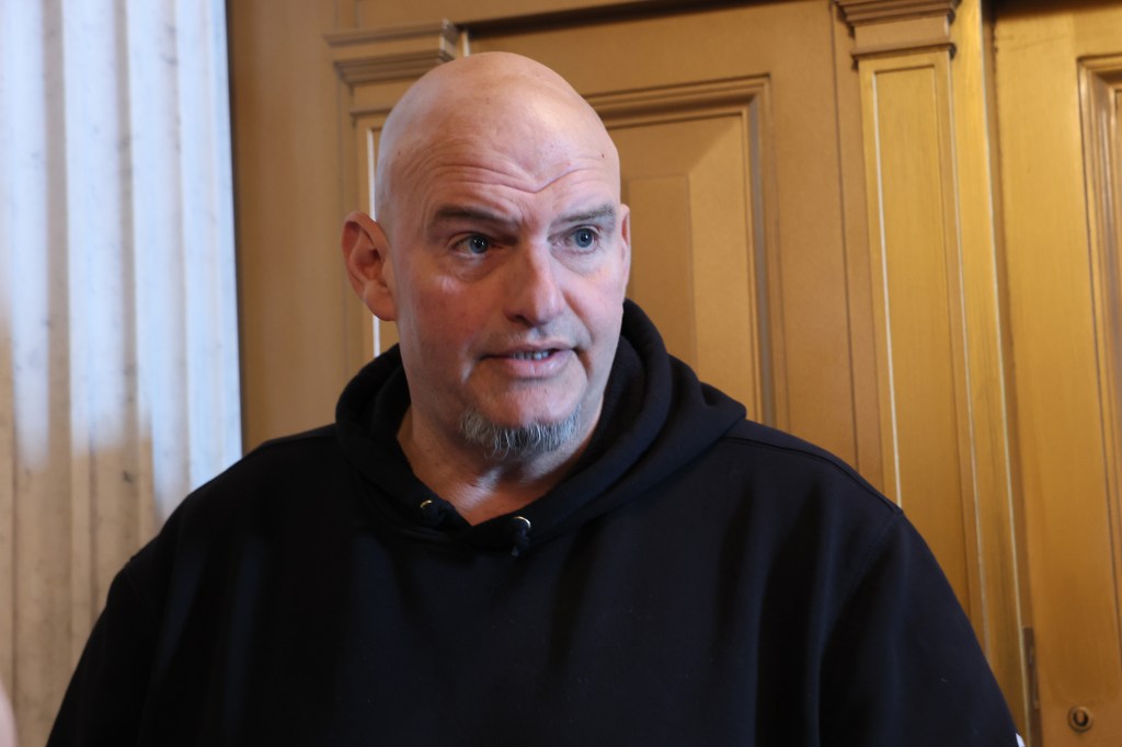 Senator John Fetterman speaking to reporters in the US Capitol.