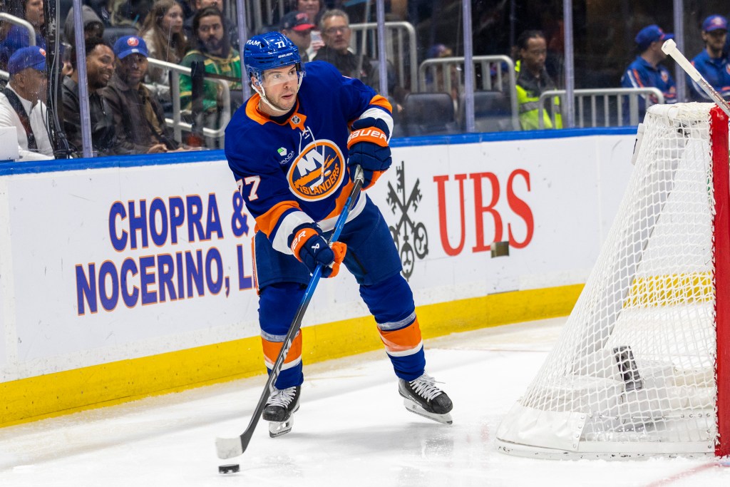 New York Islanders Tony DeAngelo looks to pass during the second period against the Calgary Flames at UBS Arena, Saturday, March 14, 2026.