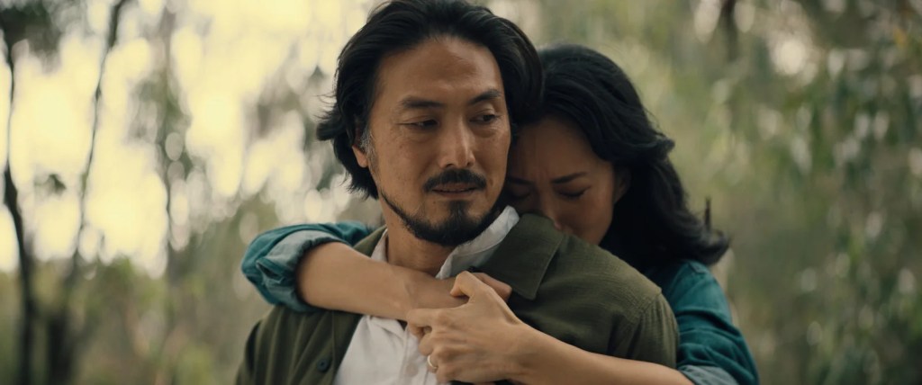 Takehiro Hira and Mari Yamamoto embracing each other in Monarch: Legacy of Monsters