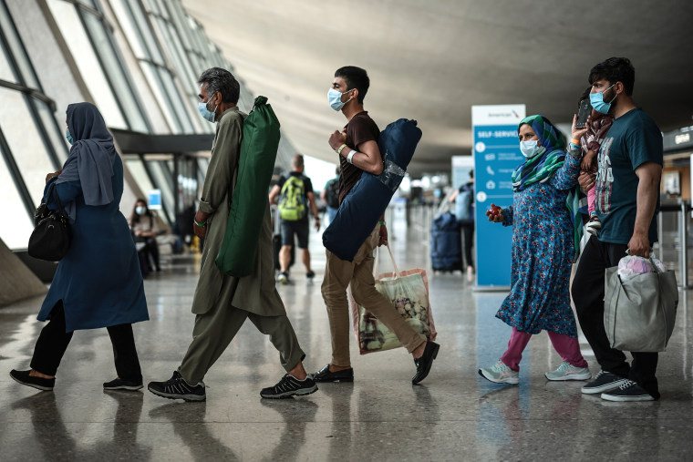 Afghan Refugees Arrive At Dulles Airport After US Pulls Out Final Troops