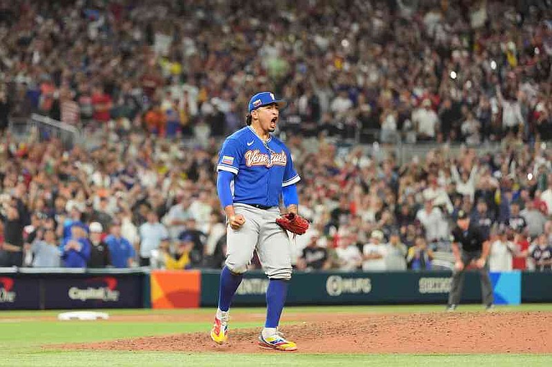 Venezuela pitcher Daniel Palencia celebrates after the team defeated the United States in the championship game of the World Baseball Classic, Tuesday, March 17, 2026, in Miami. (AP Photo/Rebecca Blackwell)