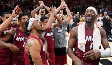 Miami Heat center Bam Adebayo, right, celebrates with teammates after he scored 83 points, the ...