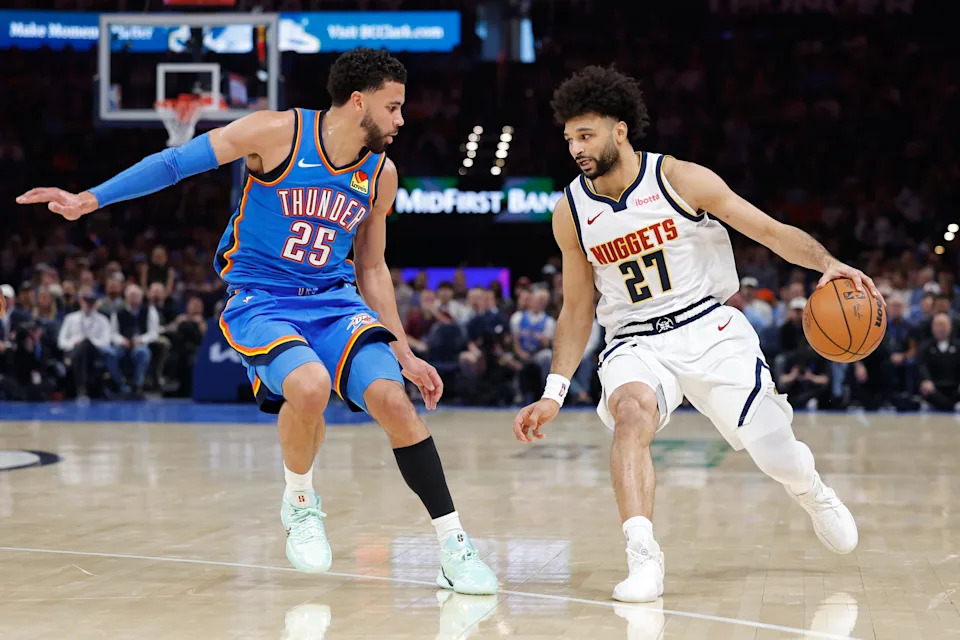 Mar 9, 2026; Oklahoma City, Oklahoma, USA; Denver Nuggets guard Jamal Murray (27) moves the ball down the court beside Oklahoma City Thunder guard Ajay Mitchell (25) during the second quarter at Paycom Center. Mandatory Credit: Alonzo Adams-Imagn Images