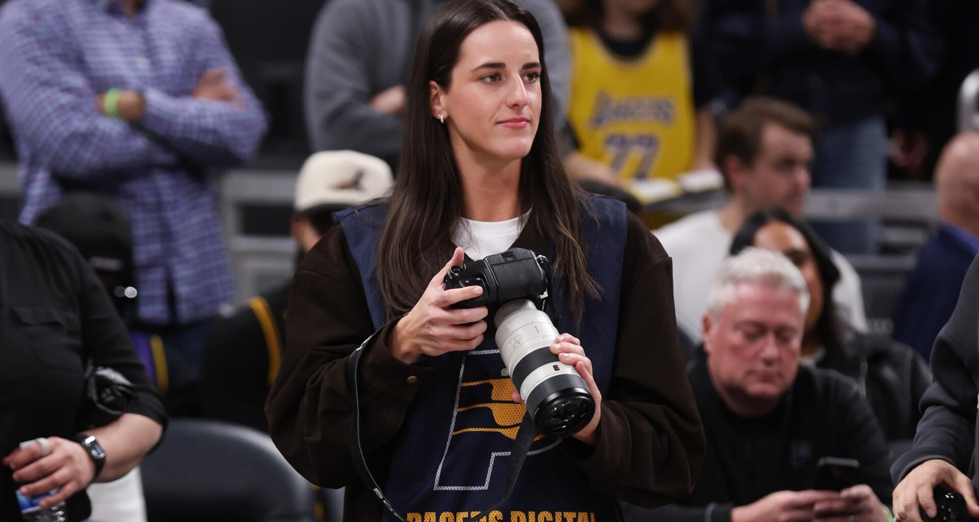 Caitlin Clark Serves as Guest Photographer for Lakers vs. Pacers in Trending Video, Photos