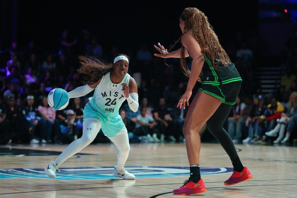 Arike Ogunbowale of Mist drives the ball against Kiki Iriafen of Phantom during the Unrivaled championship game.