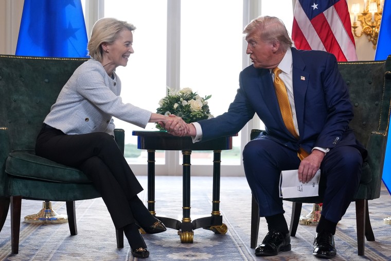 President Donald Trump and European Commission President Ursula von der Leyen shake hands.