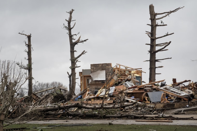 A home sits reduced to rubble after being hit by a tornado.