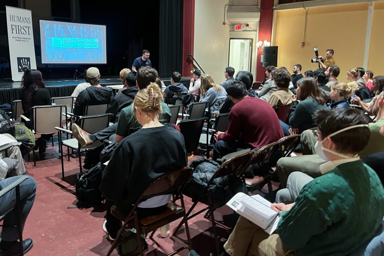 Alexander McCoy, head of the liberal coalition for Humans First, answers audience questions at St. Michael's Church Tuesday evening in New York.