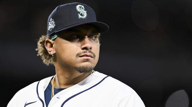 Seattle Mariners first baseman Josh Naylor (12) walks off between innings of the opening day game against the Cleveland Guardians at T-Mobile Park, on Thursday, March 26, 2026, in Seattle, Wash.