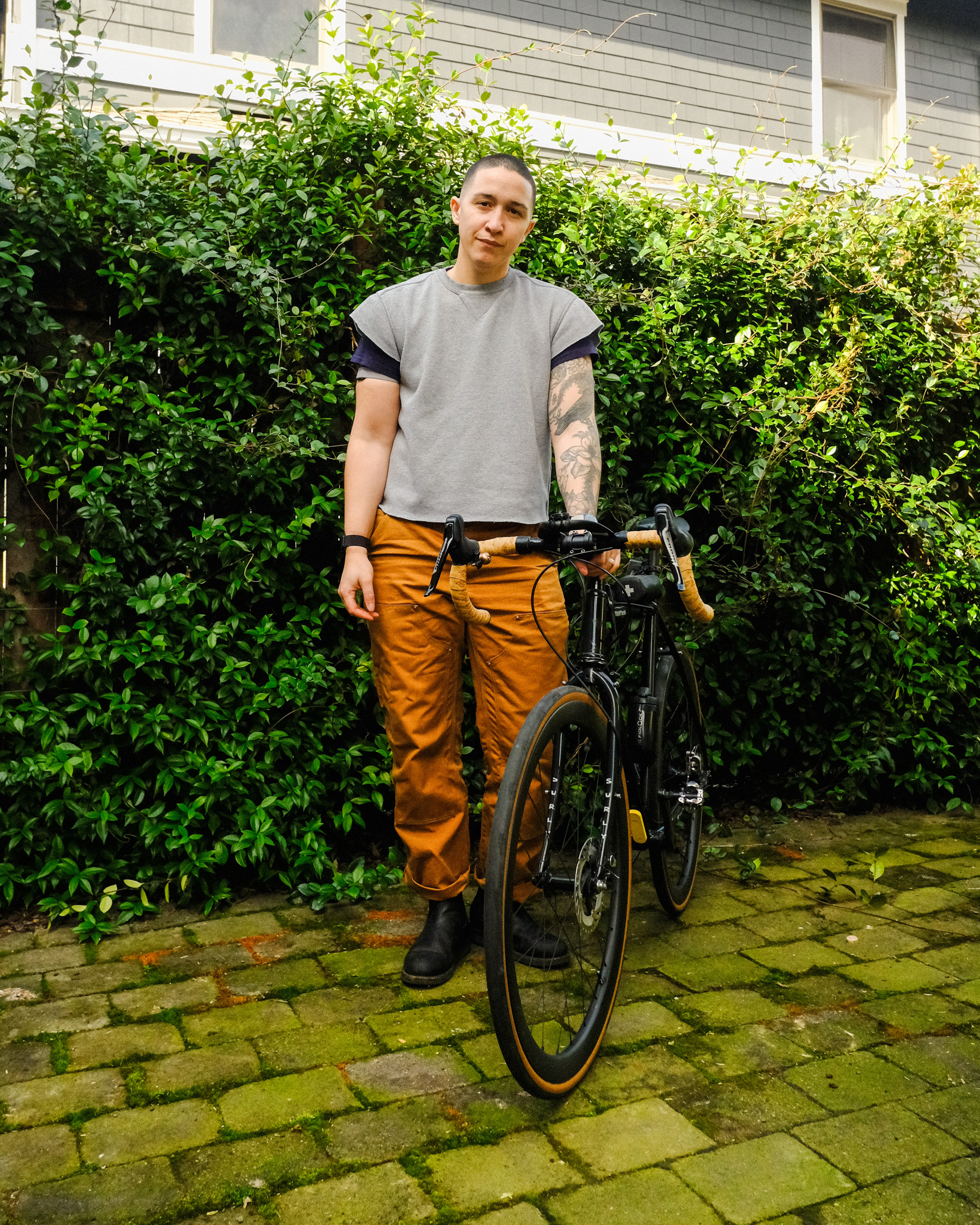 Arielle Duhaime-Ross does a bike tune-up outside.