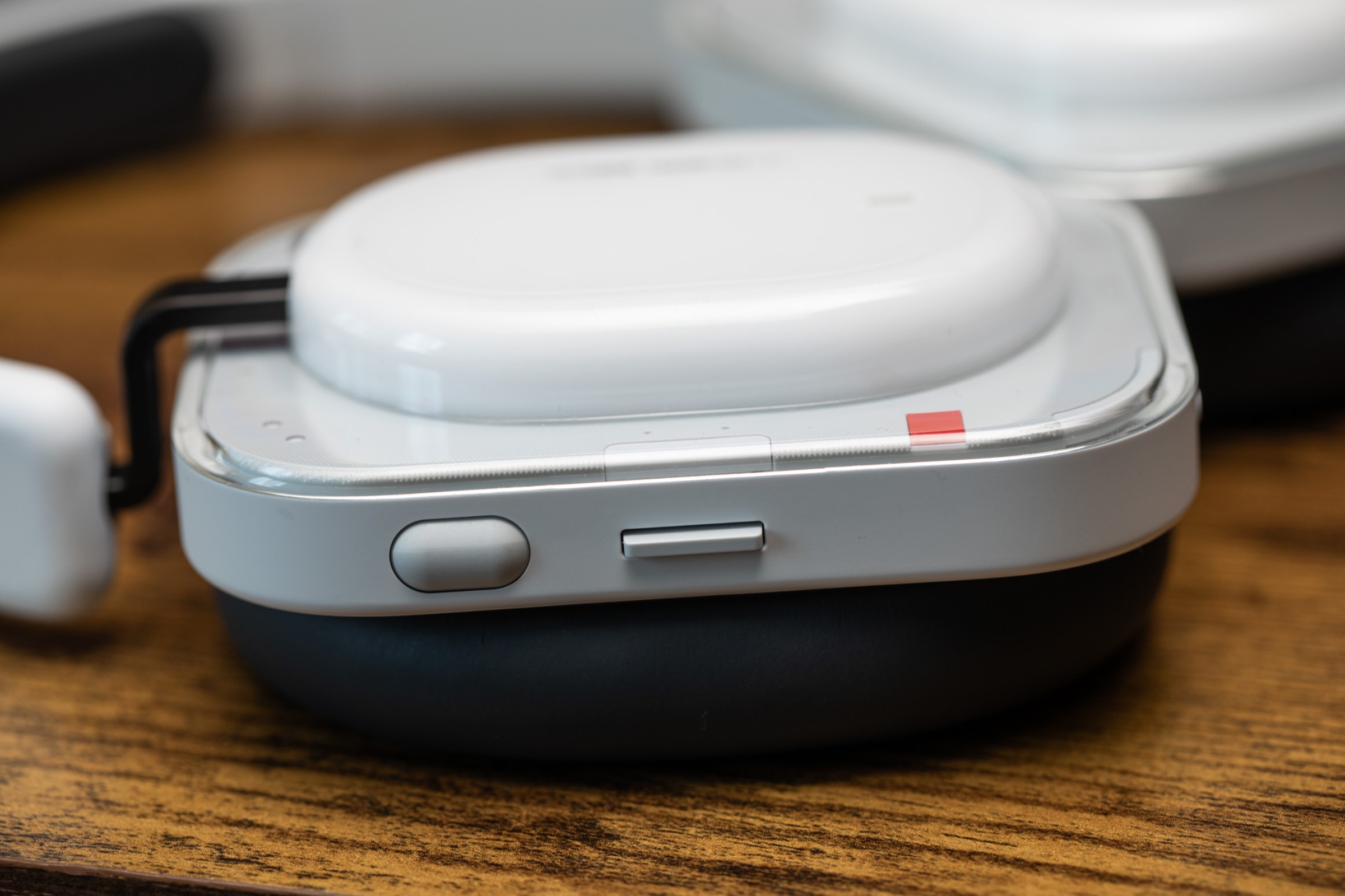 A closeup of the right ear cup of the Nothing Headphone A and its controls.