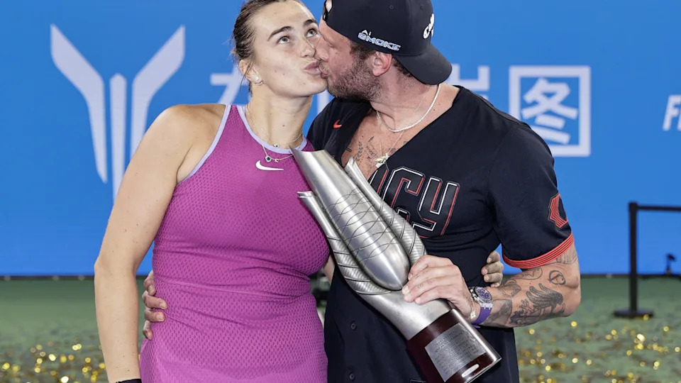 Aryna Sabalenka poses with Georgios Frangulis after winning the game against Qinwen Zheng of China during the day nine of the 2024 Wuhan Open.
