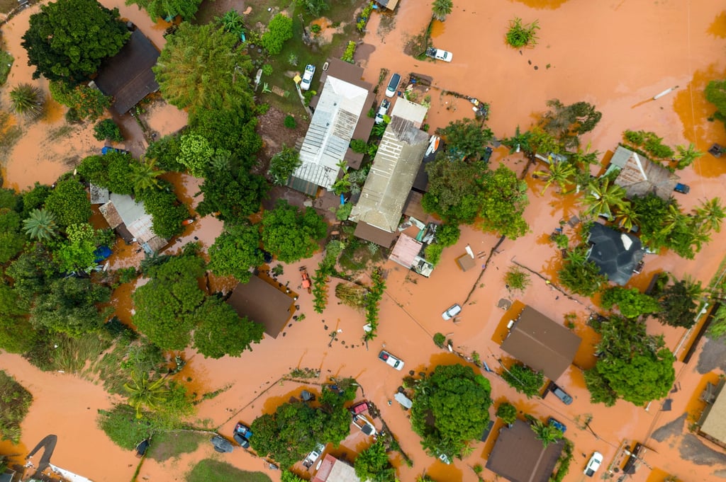 An aerial view of homes surrounded by floodwater in Waialua, Hawaii, on Friday. Photo: AP