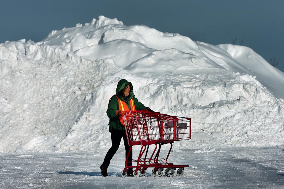 Hanover, MA - January 27: An employee at Trader Joes fetches shopping carts in the parking lot at Hanover Commons shopping area on January 27, 2026. (Photo by John Tlumacki/The Boston Globe via Getty Images)