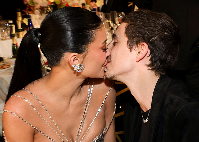 Timothée Chalamet sharing a close moment at a formal event, reflecting on claims about his Oscar chances and attitude.