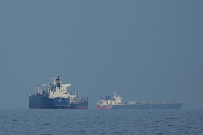 Oil tankers and cargo ships at sea 