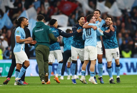 City players celebrate at the whistle.