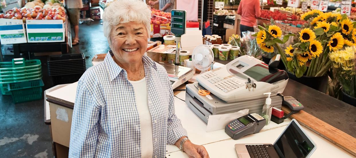 Retired woman working at market.