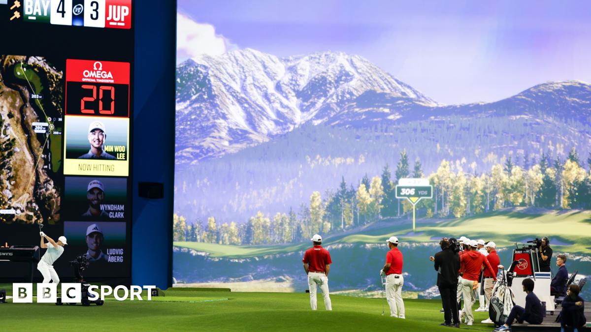 A man hitting a shot on an indoor golf simulator