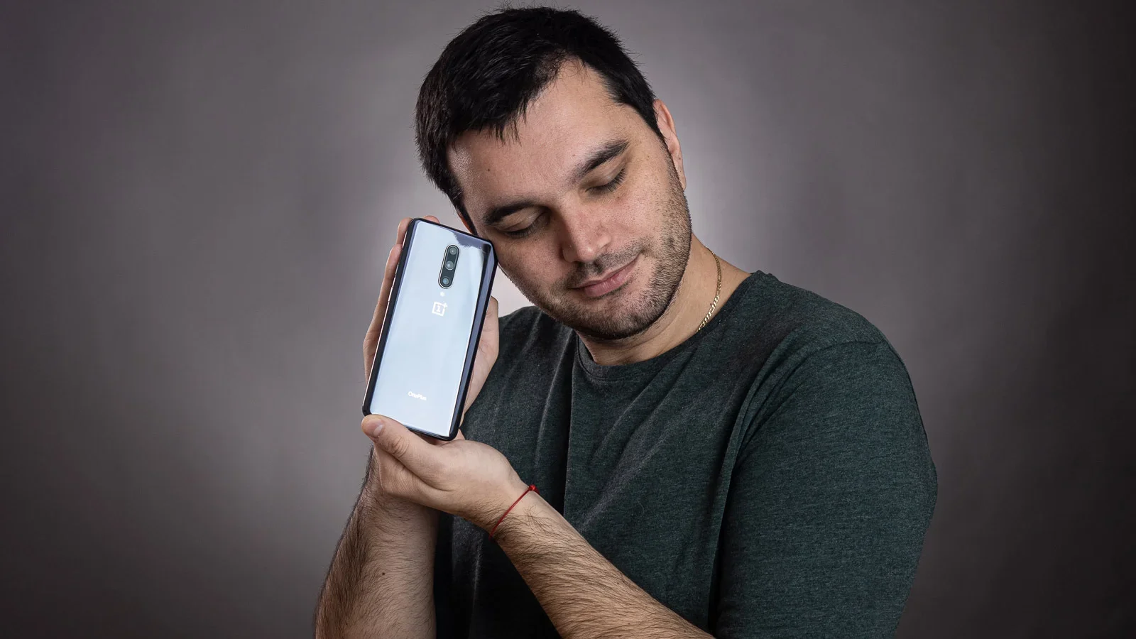 A man and a phone indoors.