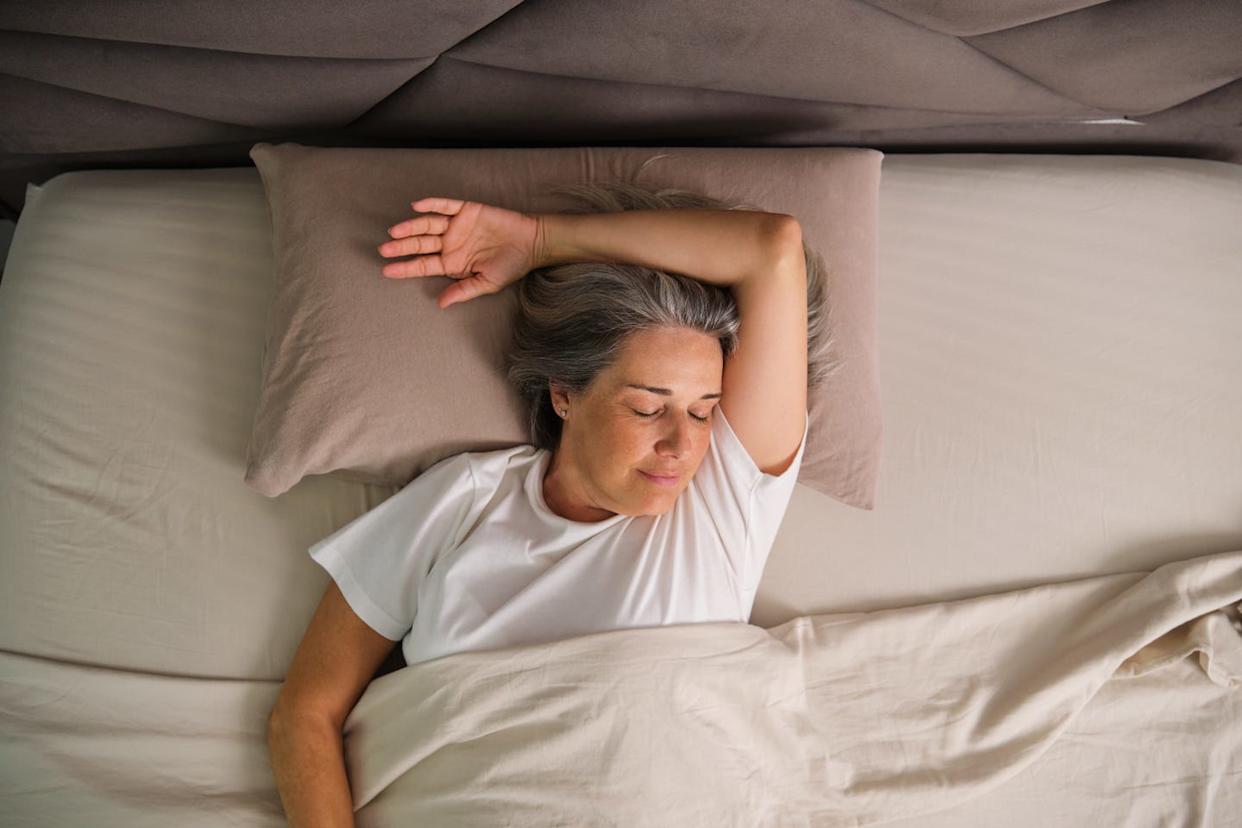 person sleeping comfortably in bed during morning routine