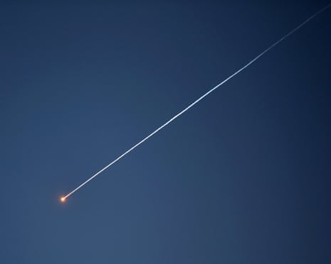 A view of missile traces launched from Yemen at Israel sighted in the sky over Hebron in the occupied West Bank, on 28 March.