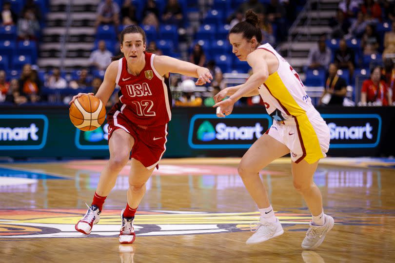 Caitlin Clark drives to the basket