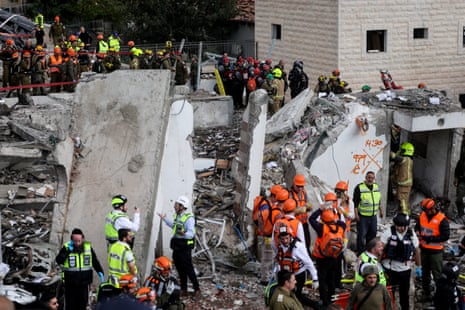 Emergency personnel work at the site of an Iranian strike in Beit Shemesh, Israel.