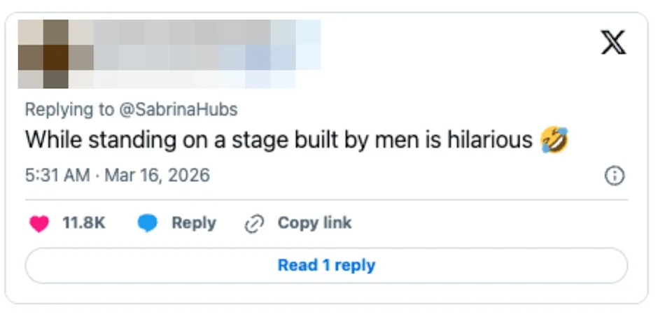 A tweet from @MeowMixMRE: "While standing on a stage built by men is hilarious ?" with engagement icons below