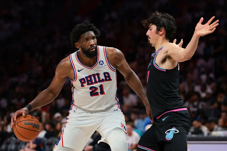 Mar 30, 2026; Miami, Florida, USA; Philadelphia 76ers center Joel Embiid (21) drives to the basket against Miami Heat forward Jaime Jaquez Jr. (11) during the third quarter at Kaseya Center. Mandatory Credit: Sam Navarro-Imagn Images