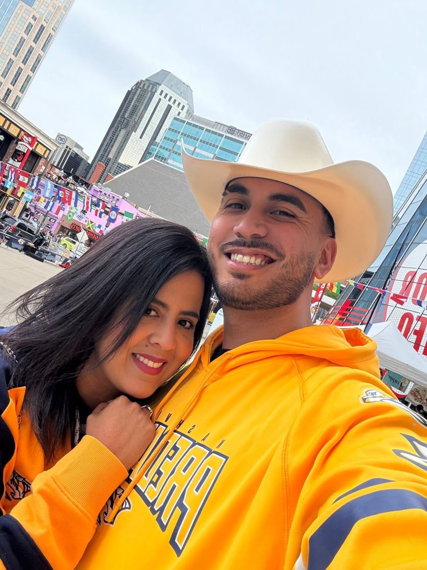 Estefany Rodriguez poses for a photo with her husband Alejandro Medina.