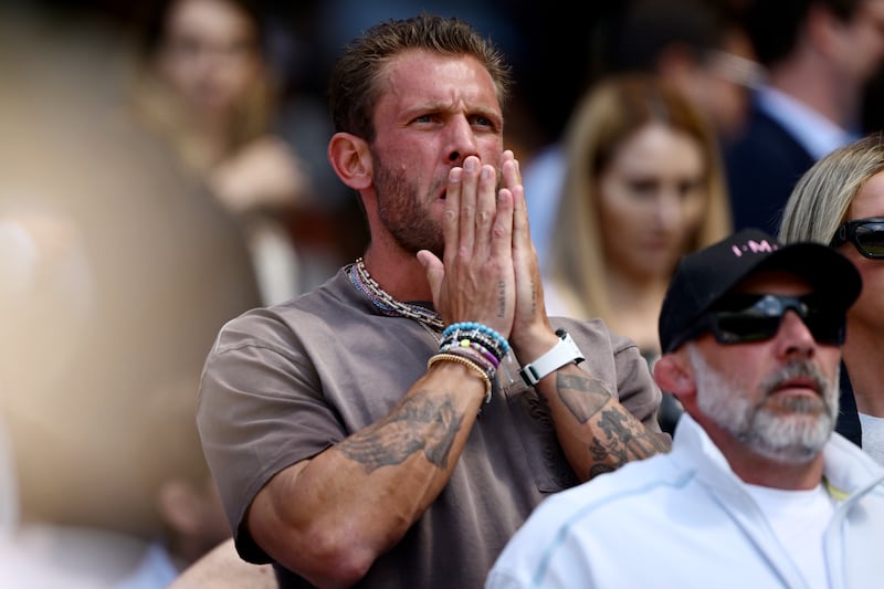 A worried-looking Georgios Frangulis watches Aryna Sabalenka's match against Laura Siegemund of Germany during the 2025 Wimbledon quarterfinals on July 8, 2025, in London, England. Sabalenka defeated Siegemund 4–6, 6–2, 6–4, but went on to lose against Amanda Anisimova in the next round.