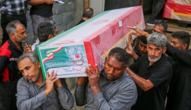 A coffin is carried Tuesday during the funeral of mostly children killed in what Iranian officials said was an Israeli-U.S. strike Feb. 28 at a girls' elementary school in Minab, Iran.
