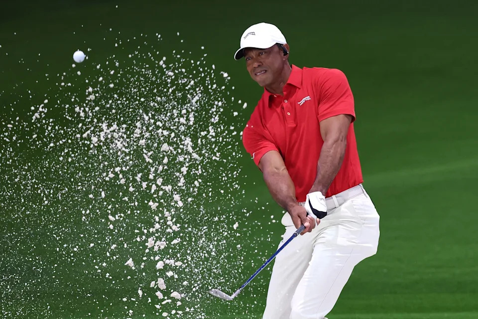 Adam Glanzman/TGL Golf via Getty Images - PHOTO: Tiger Woods of Jupiter Links Golf Club plays a shot from a bunker on the eighth hole during the match against the Los Angeles Golf Club, March 24, 2026 in Palm Beach Gardens, Florida.