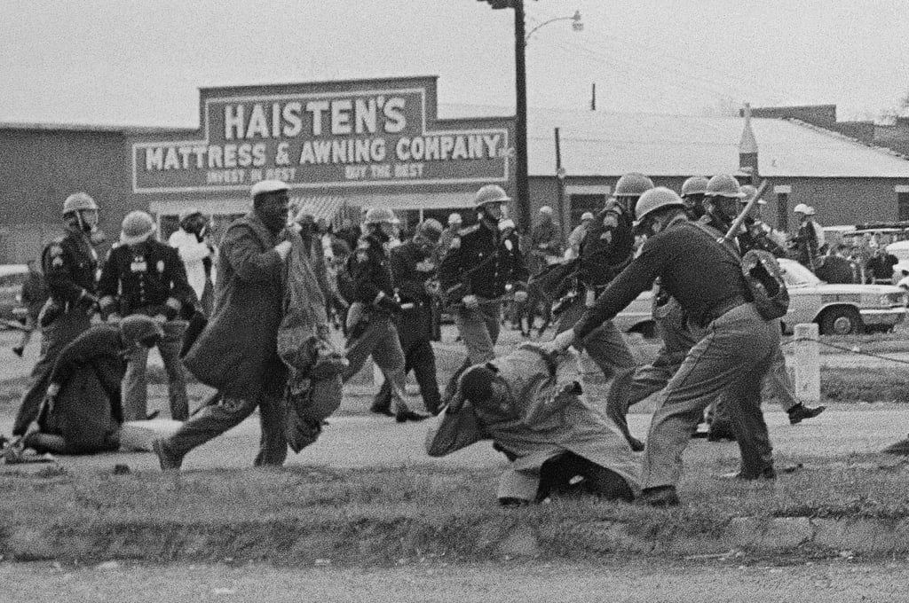 State troopers hit protesters with billy clubs to break up a civil rights voting march in Selma, Alabama on “Bloody Sunday”, March 7, 1965. Photo: AP