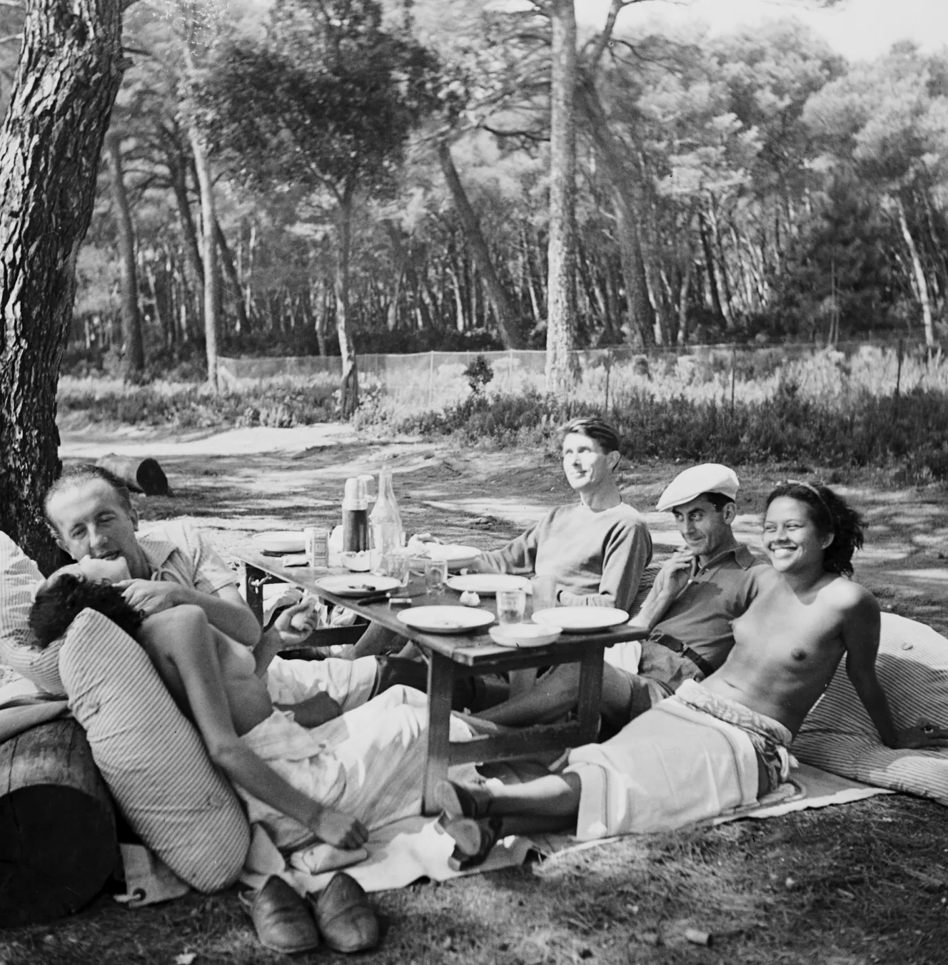 Nusch and Paul Éluard, Roland Penrose, Man Ray, and Ady Fidelin at a picnic.