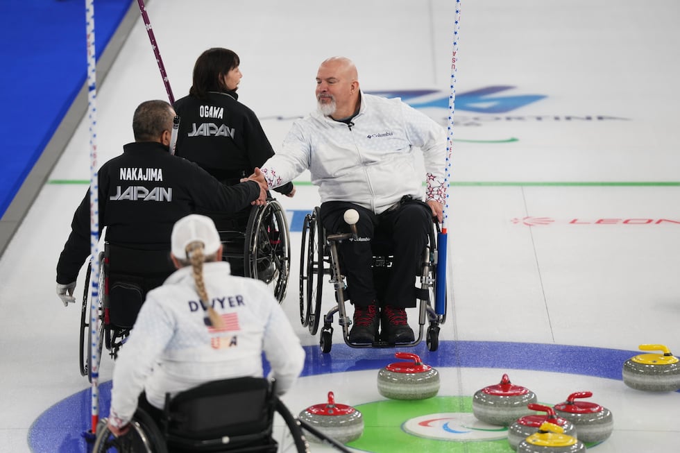 Steve Emt, right, and Laura Dwyer, of the United States, and Yoji Nakajima, left, and Aki...
