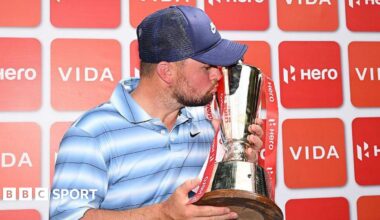 Alex Fitzpatrick kisses the Indian Open trophy