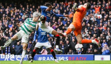 Celtic's Daizen Maeda headers the ball off Rangers defender Dujon Sterling's arm