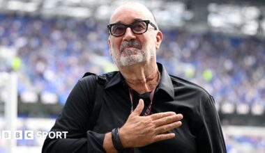 Designer Dan Meis applauds Everton fans at their first home match in their new stadium.