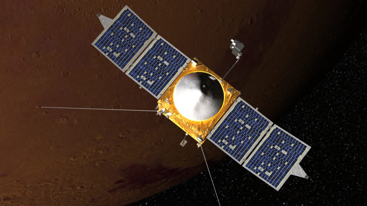 a cube-shaped spacecraft with two wing-like solar panels above a cratered reddish-orange planet