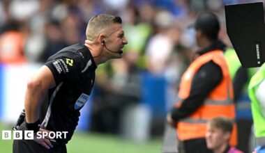 Feferee Robert Jones checks the VAR screen during a match between Fulham and Chelsea