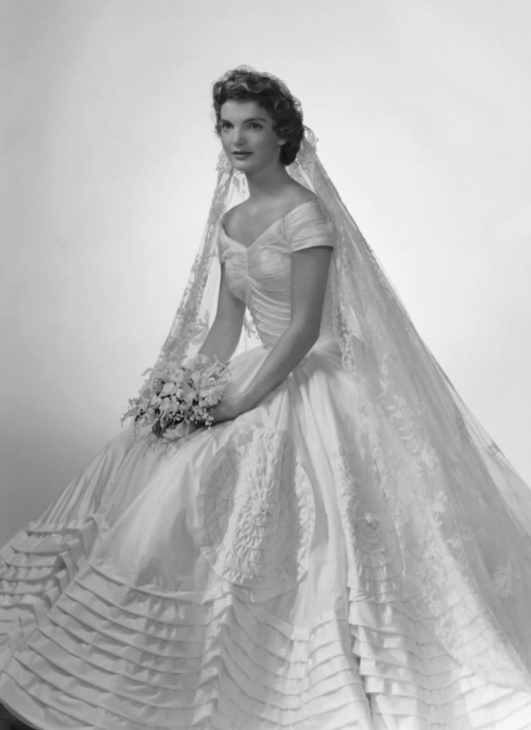 Jacqueline Kennedy married John F. Kennedy in 1953, wearing a silk taffeta gown with pleated designs around the skirt and bodice. Getty Images