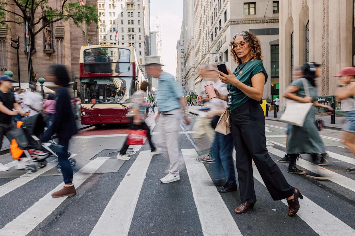 Woman crossing in downtown New York City