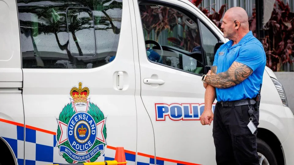 A hotel security member stands at the entrance of the hotel, where members of the Iranian women's soccer team are staying, on the Gold Coast on March 9. - Patrick Hamilton/AFP/Getty Images