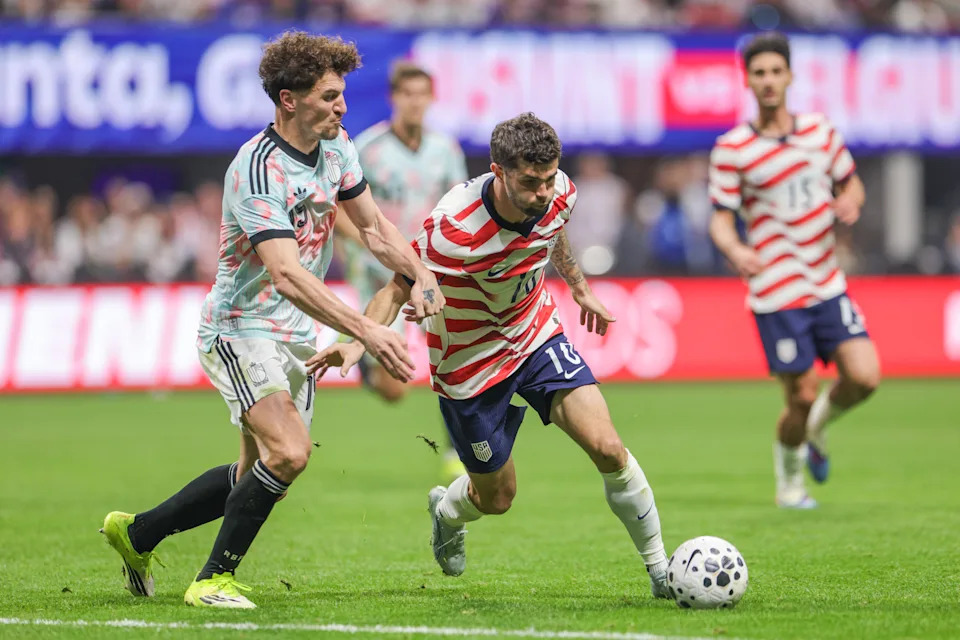ATLANTA, GEORGIA - MARCH 28: Christian Pulisic #10 of the United States is marked by Thomas Meunier #15 of Belgium during the first half of an international friendly at Mercedes-Benz Stadium on March 28, 2026 in Atlanta, Georgia. (Photo by John Dorton/ISI Photos/USSF/Getty Images)