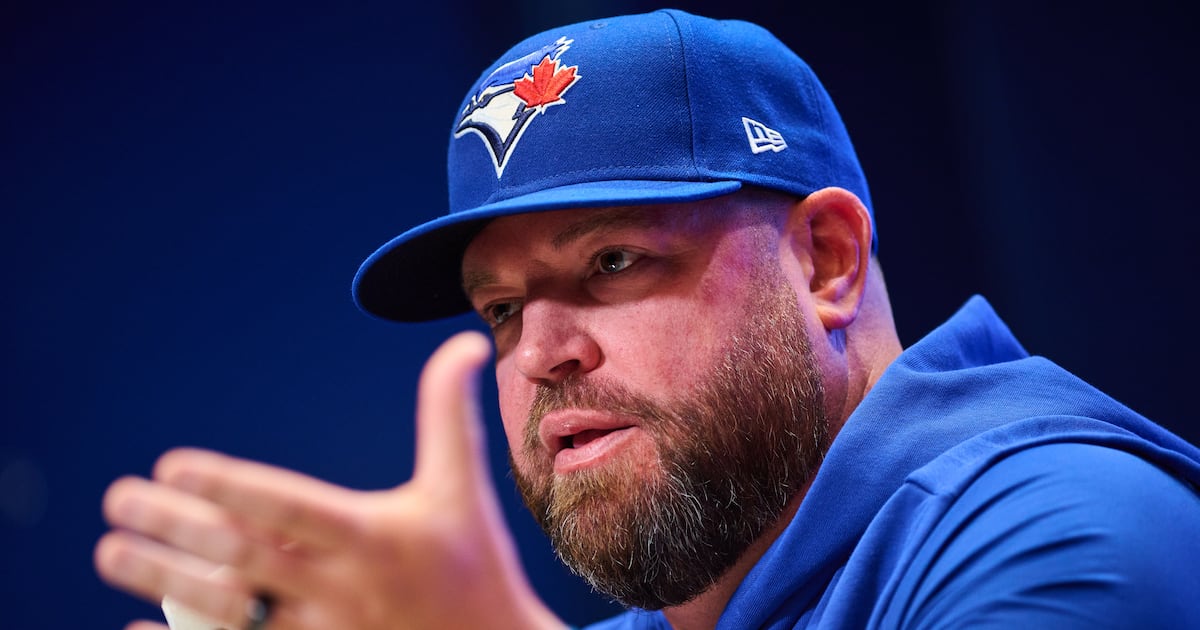 Toronto Blue Jays’ John Schneider gets reassurance from Golden State Warriors’ Steve Kerr