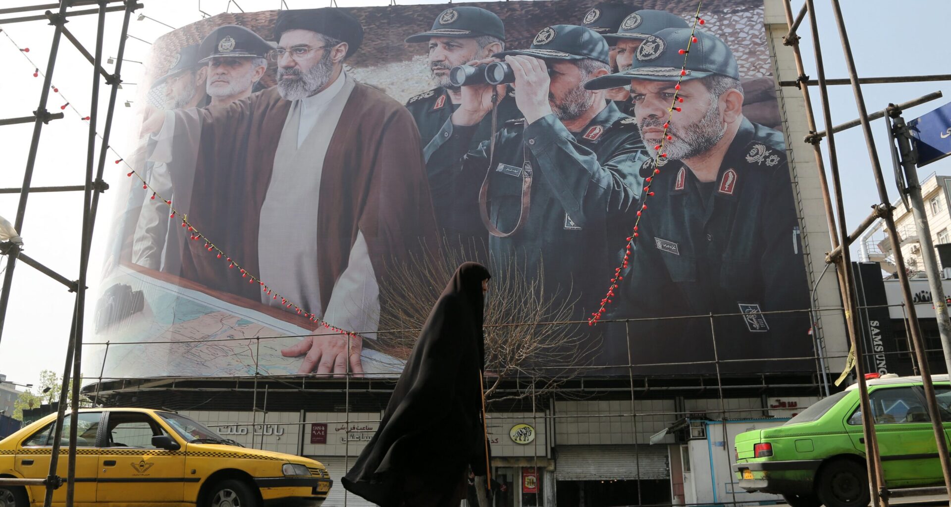 A view of a banner featuring Iranâ€™s new Supreme Leader Mojtaba Khamenei and senior commanders of the Islamic Revolutionary Guard Corps (IRGC) as the attacks by the United States and Israel against Iran continue on March 14, 2026.
