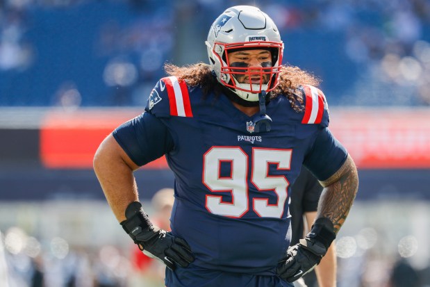 New England Patriots defensive tackle Khyiris Tonga warms up prior to the start of an NFL game against the Carolina Panthers, Sunday, Sept. 28, 2025, in Foxboro. (AP Photo/Greg M. Cooper)